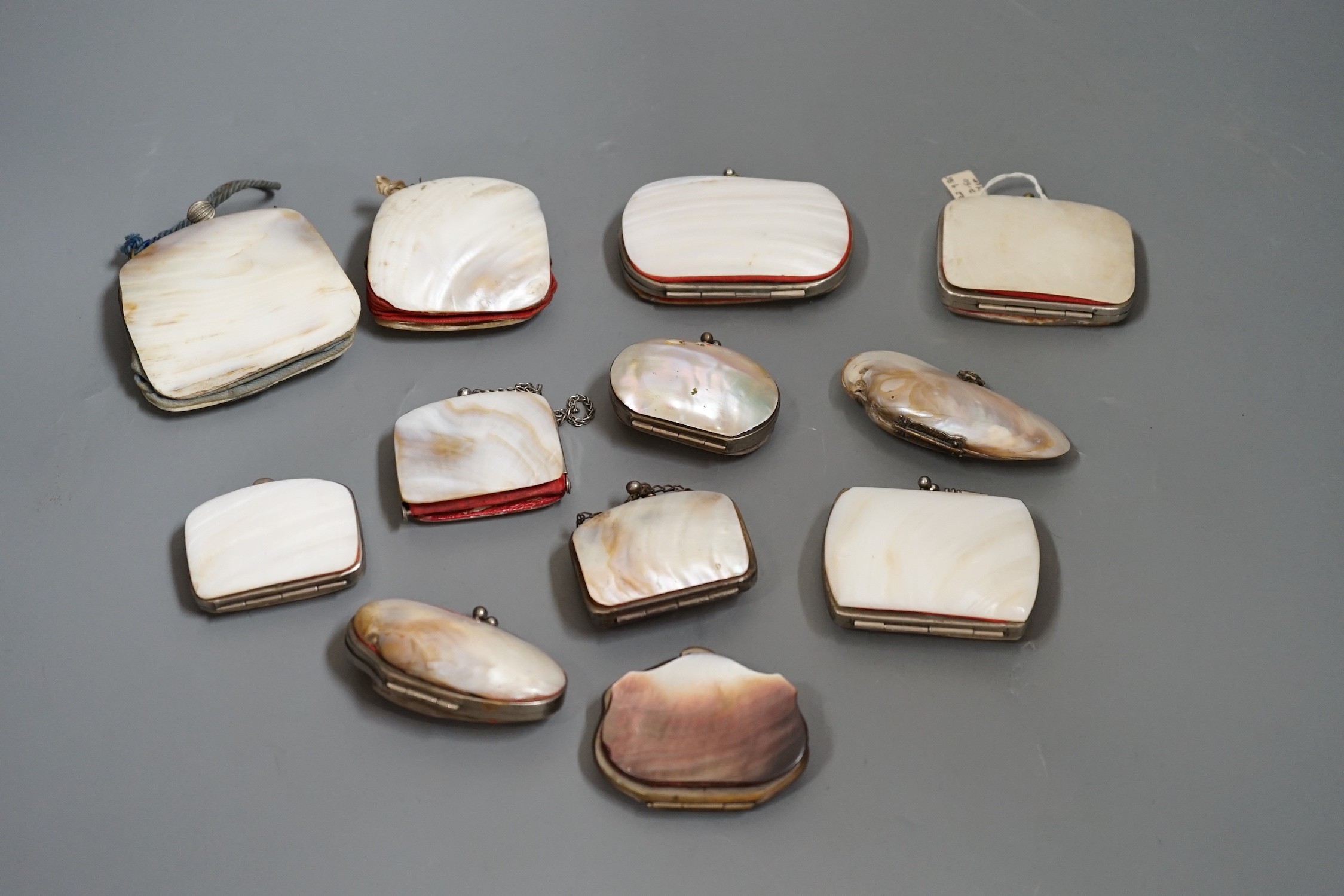 Nine 19th century souvenir mother of pearl purses, and three others